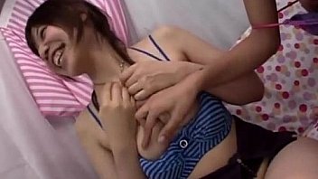 Asian girl kissing getting her tits and pussy rubbed on the couch