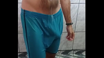 Big dick visible through the nylon shorts during a shower