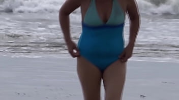 Beautiful stepmom showing off on the beach and making cocks hard