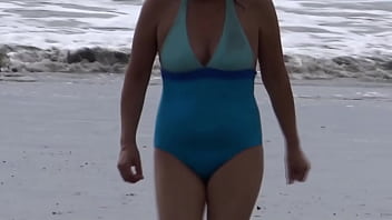 Beautiful stepmom showing off on the beach and making cocks hard