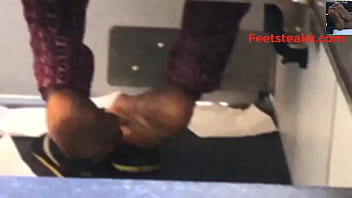 Ebony feet on bus
