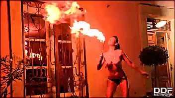 Flaming hot sexy pyromaniac plays with fire
