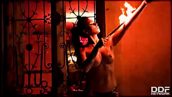 Flaming hot sexy pyromaniac plays with fire