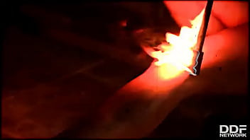 Flaming hot sexy pyromaniac plays with fire