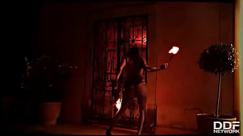Flaming hot sexy pyromaniac plays with fire
