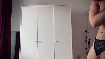 Seductive strip dance of a young lady with fancy hair