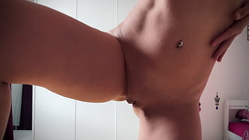 Seductive strip dance of a young lady with fancy hair