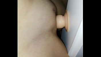 A fucking woman between the doorframes