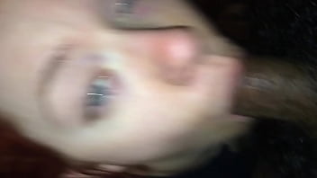 Redhead made to take black cock in her mouth