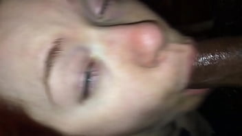 Redhead made to take black cock in her mouth