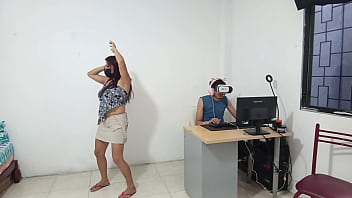 Woman dances sexily in front of him