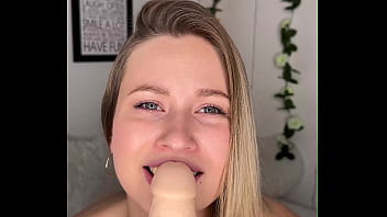 Blonde sucks big dildo on camera