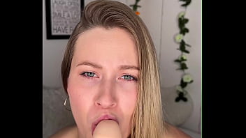 Blonde sucks big dildo on camera