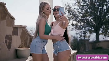 Lovely lesbo teens kiss and make out in cozy bedroom