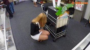 Hot milf sells her stuff and gives head in storage room