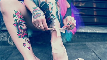 Ballerina wearing ballet shoes and walking down the street