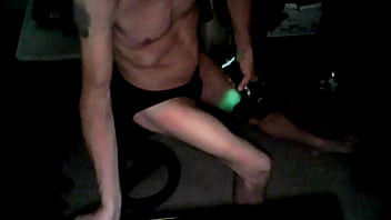 Percussion massager on thigh in underwear on stool in briefs from june 2022