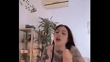 Tattooed girl sucks and jacks off dildo Tattooed girl sucks and jacks off dildo