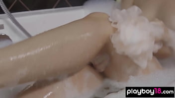 Bombastic busty blonde beauty relaxing in the bath