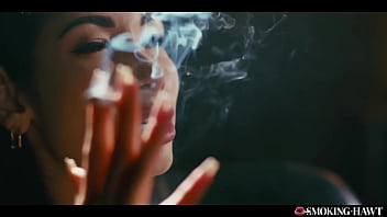 French brunette with huge fake tits masturbates while smoking cigarette and talking dirty