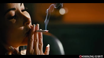 French brunette with huge fake tits masturbates while smoking cigarette and talking dirty