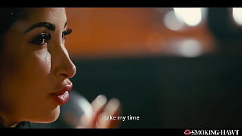 French brunette with huge fake tits masturbates while smoking cigarette and talking dirty