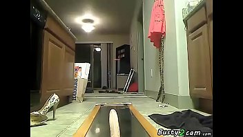 Brunette playing with a dildo