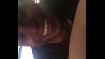 Black man eats sushi