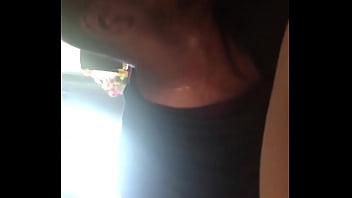 Black man eats sushi