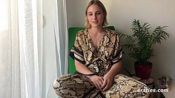 Ophelia enjoys a book as well as rubbing her pussy