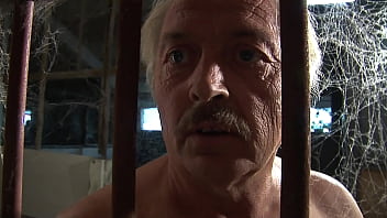 She gets locked in a cell by an old pervert and he demands she strip off her clothes and