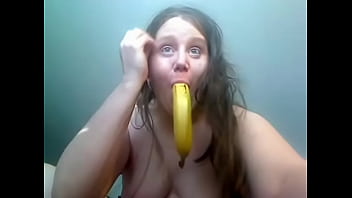 Amateur girl playing with banana