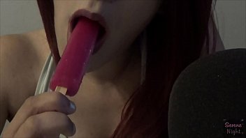 Latina sucking on a frozen pop