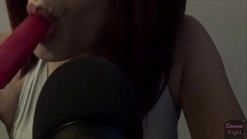 Latina sucking on a frozen pop