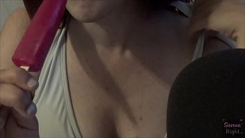 Latina sucking on a frozen pop