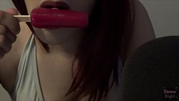 Latina sucking on a frozen pop