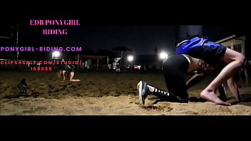 Man rides his pony without kneepads on the sand