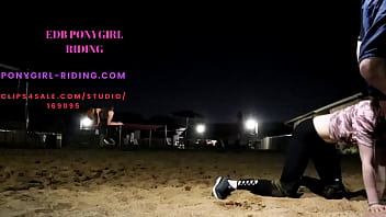 Man rides his pony without kneepads on the sand