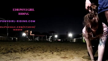 Man rides his pony without kneepads on the sand