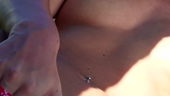 Sexy brunette girl masturbating in the tropical garden