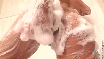 Busty Fox Soaping Her Bazookas thumbnail