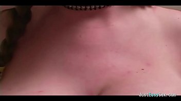 Pigtailed brunette plays with big tits