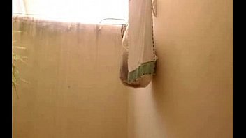 Busty shows her tits in her house