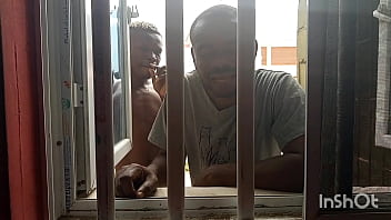 An african mum was feeling her self and her neighbor was peeping at her from the window