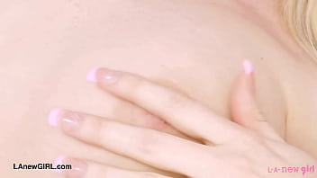 Alluring blonde model naked close up