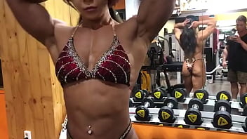 Asian muscle girl flexing and working out