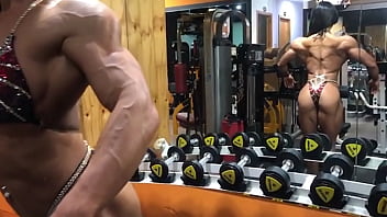 Asian muscle girl flexing and working out
