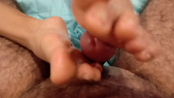 Giving feet job while giggling with joy