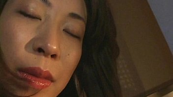 Lady in fishnets and bikini is horny that she rubs her tits and pussy