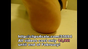 Cute girl removes her shoes after sweaty socks and soles